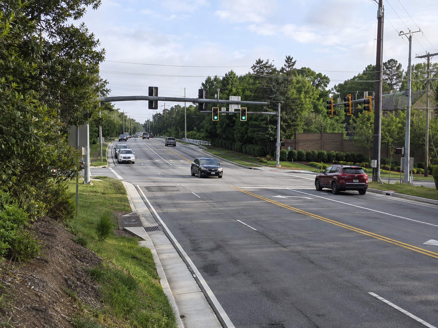 Cars passing by the traffic light
